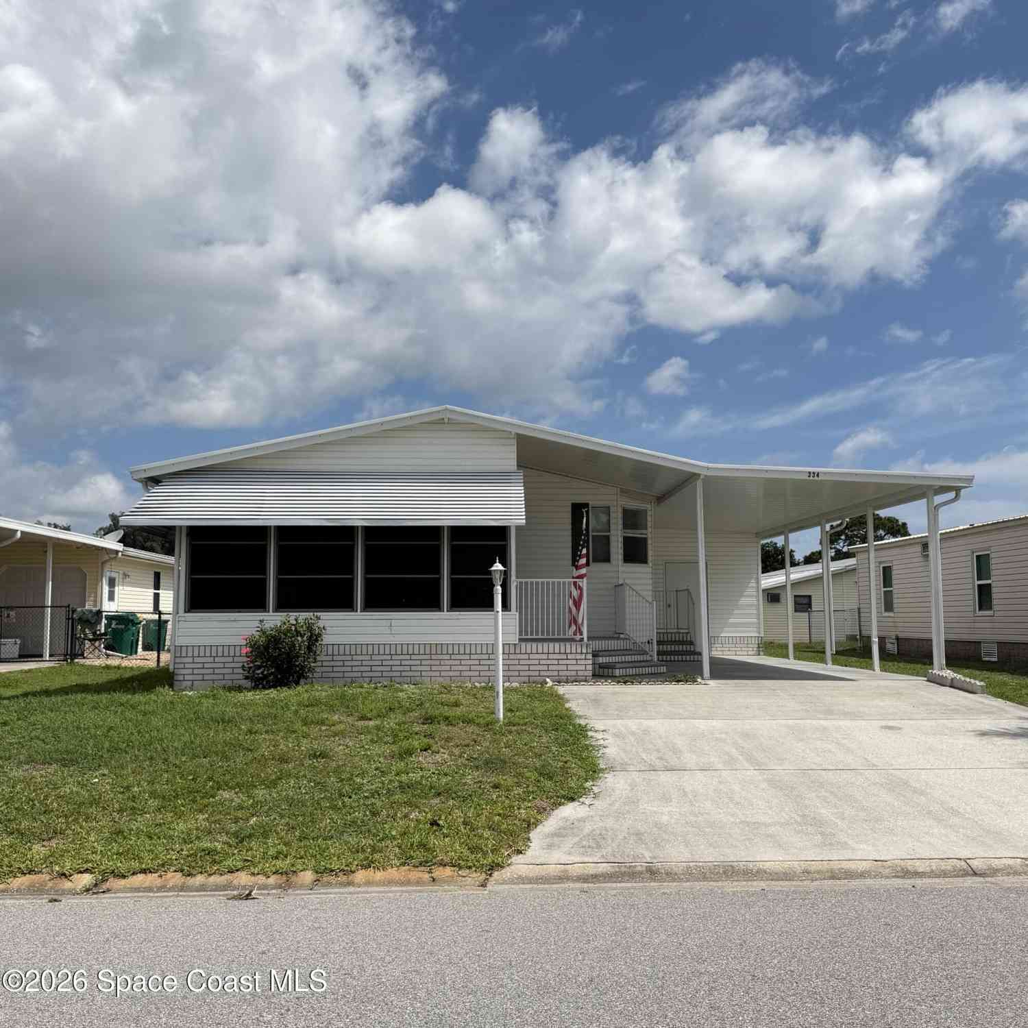 Mobile Home For Sale - 334 Macadamia Drive<br/> Barefoot Bay, FL 32976