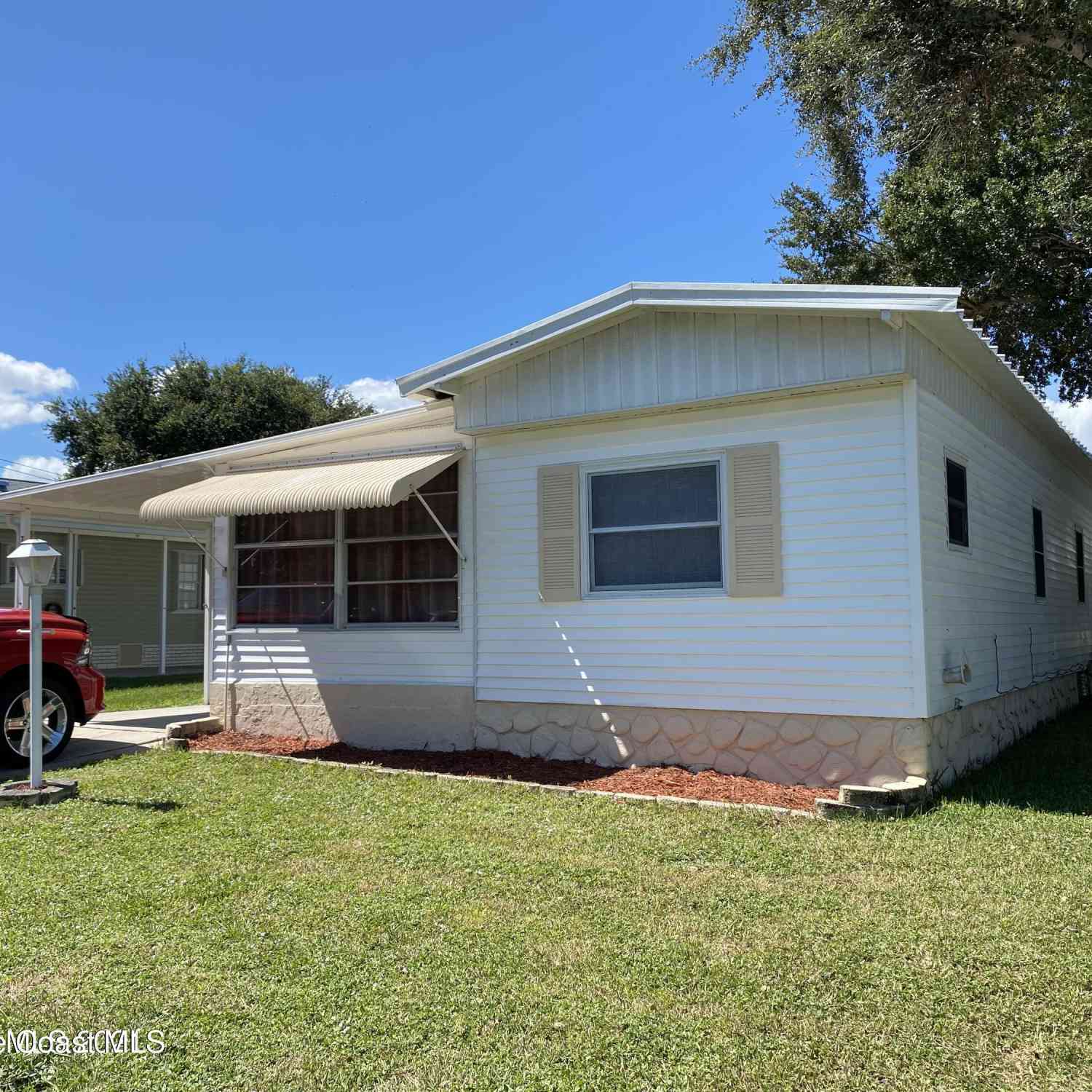 Mobile Home For Sale - 703 Lark Drive<br/> Barefoot Bay, FL 32976