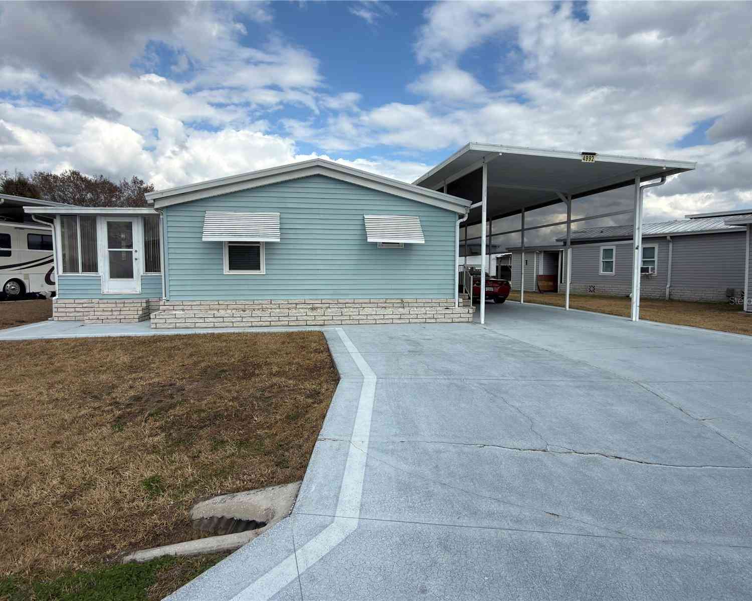Mobile Home For Sale - 4992 Shore Line Drive<br/> POLK CITY, FL 33868